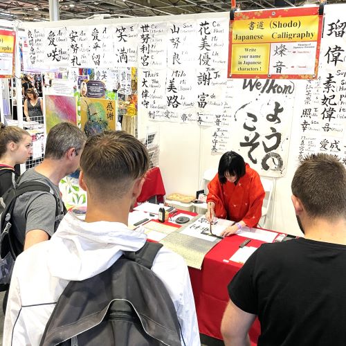 At the festival, everyone's name is changed into Japanese character (Kanji) and written in Japanese calligraphy.